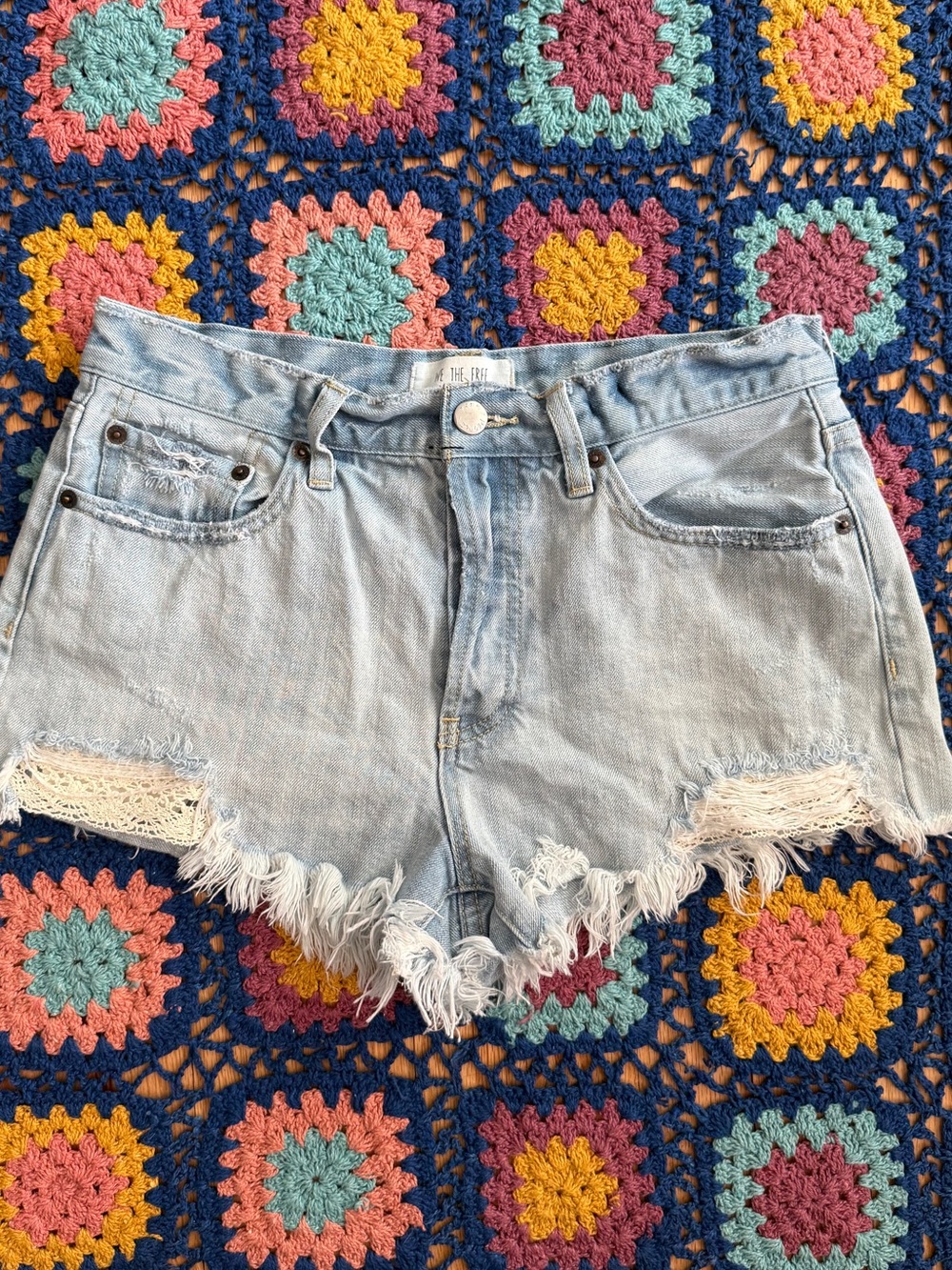 We The Free Light Wash Distressed Denim Shorts with Lace Detail